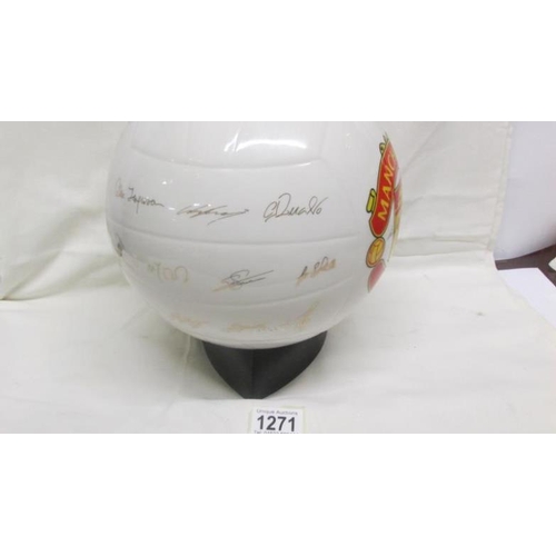 1271 - A ceramic football inscribed 'The Manchester United Championship Trophy' on stand