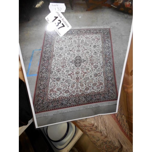 137 - Rug with floral design (approx 7' x 5')