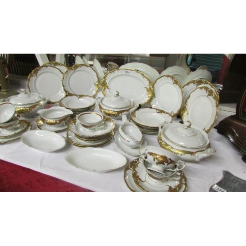 1374 - A 36 pieces Polish dinner set with gilded decoration