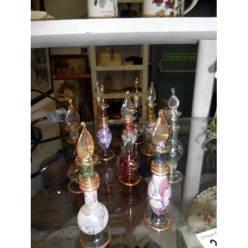 363 - Leaded glass church table lamp, glass perfume bottles and glass filigree ornaments