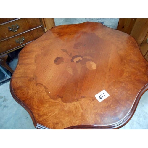 477 - A dark wood stained tripod table with decorative top