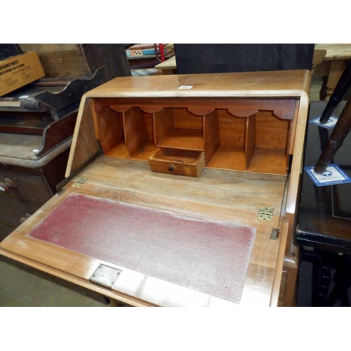 492 - A 1930s walnut veneered bureau