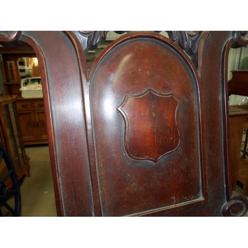 496 - A Victorian mahogany shield back hall chair