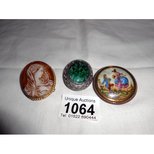 1064 - A vintage Limoges brooch depicting a couple frolicking, a cameo brooch and one other