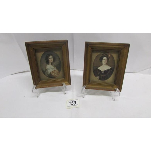 159 - A pair of framed and glazed miniature portraits of ladies