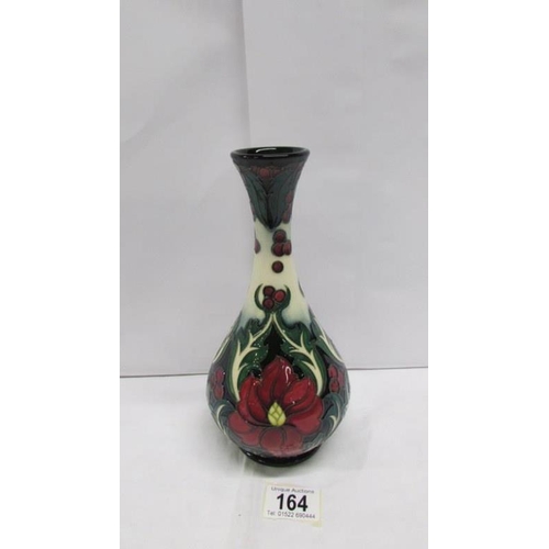 164 - A boxed Moorcroft ruby vase signed by Rachel Bishop