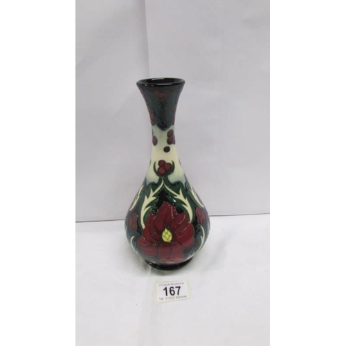 167 - A boxed Moorcroft ruby vase signed Rachel Bishop