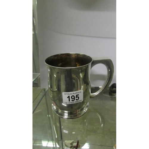 195 - A 19th century silver plated tankard with 1890 Victorian crown set in bottom