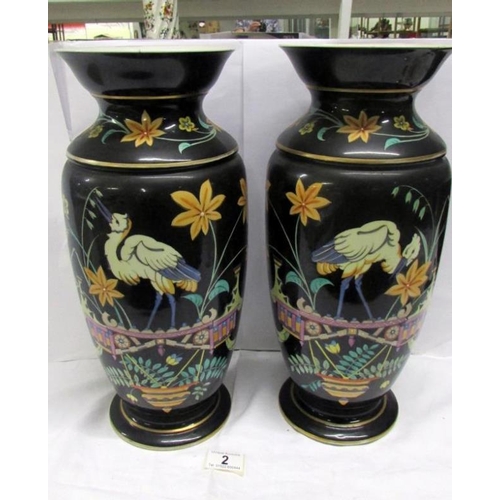 2 - A large pair of continental 19th century vases decorated with herons, 40 cm tall, (crack to rim of o... 