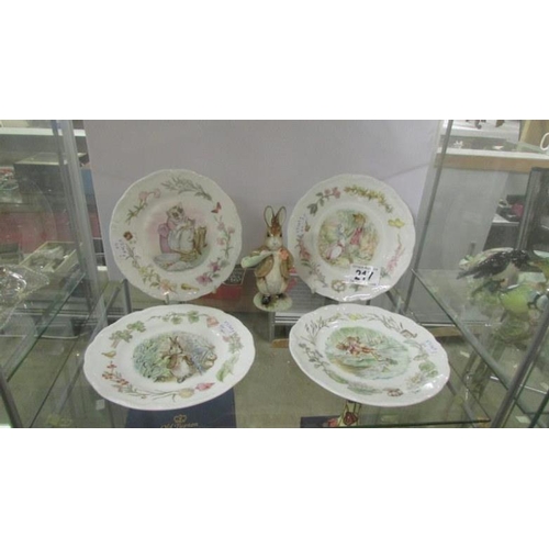 217 - A Royal Albert Beatrix Potter figurine 'Benjamine ate a Lettuce leaf' and 4 plates