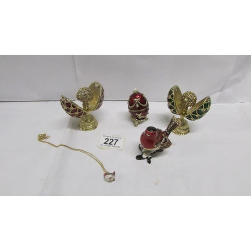 227 - 3 Faberge' style eggs, an ornamental robin and a robin pendant