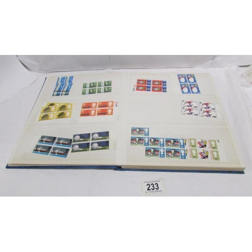 233 - An album of mint Elizabeth II pre-decimal stamps including definitives and commemorative, mainly in ... 