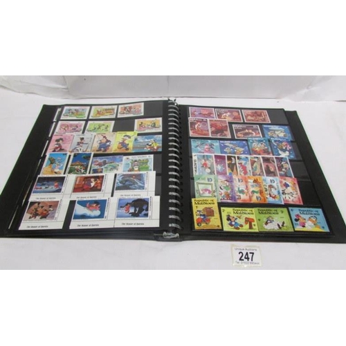 247 - An album of mainly mint Disney stamps, Angilla, Belize, Dominica, Grenada etc, mainly in sets