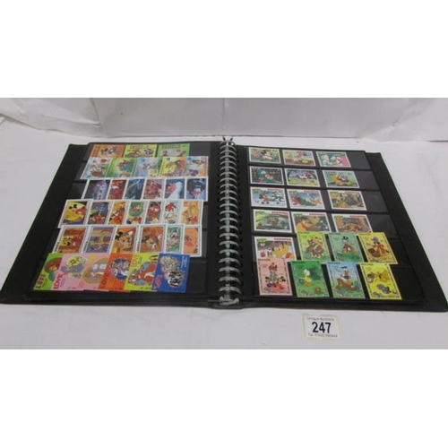 247 - An album of mainly mint Disney stamps, Angilla, Belize, Dominica, Grenada etc, mainly in sets