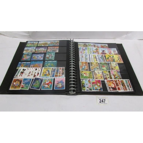 247 - An album of mainly mint Disney stamps, Angilla, Belize, Dominica, Grenada etc, mainly in sets