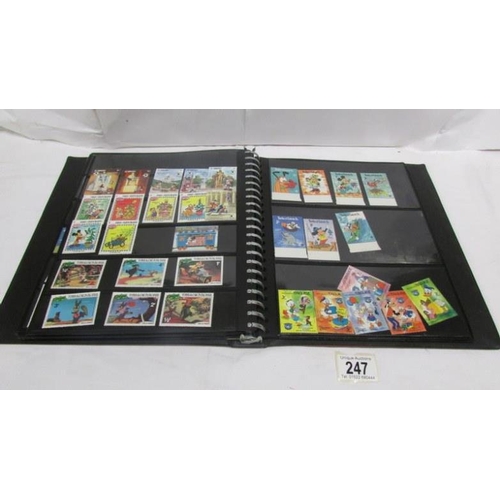 247 - An album of mainly mint Disney stamps, Angilla, Belize, Dominica, Grenada etc, mainly in sets