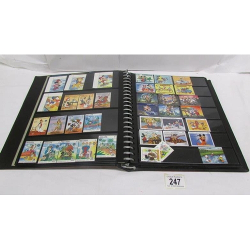 247 - An album of mainly mint Disney stamps, Angilla, Belize, Dominica, Grenada etc, mainly in sets