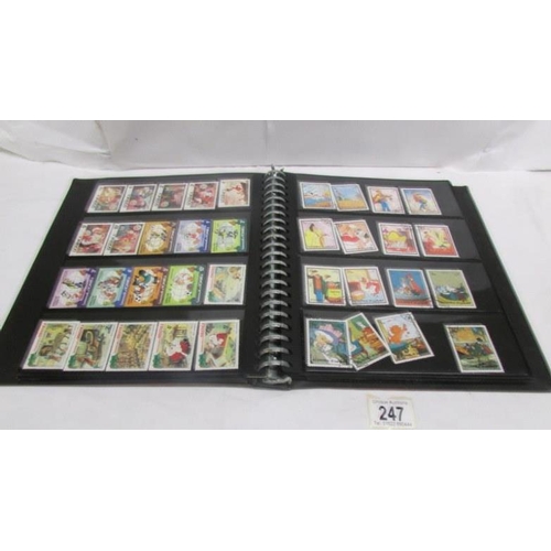 247 - An album of mainly mint Disney stamps, Angilla, Belize, Dominica, Grenada etc, mainly in sets