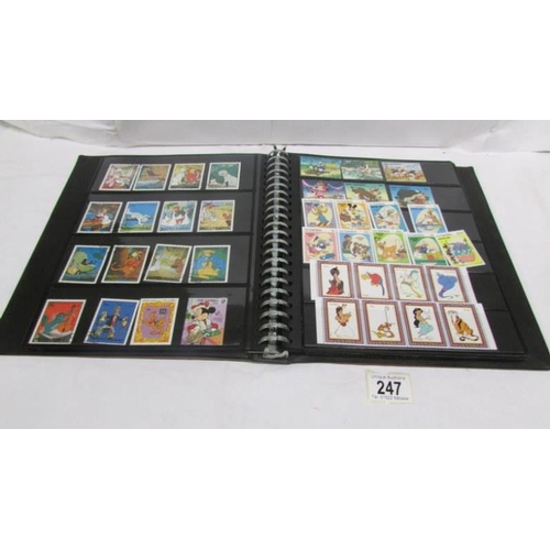 247 - An album of mainly mint Disney stamps, Angilla, Belize, Dominica, Grenada etc, mainly in sets