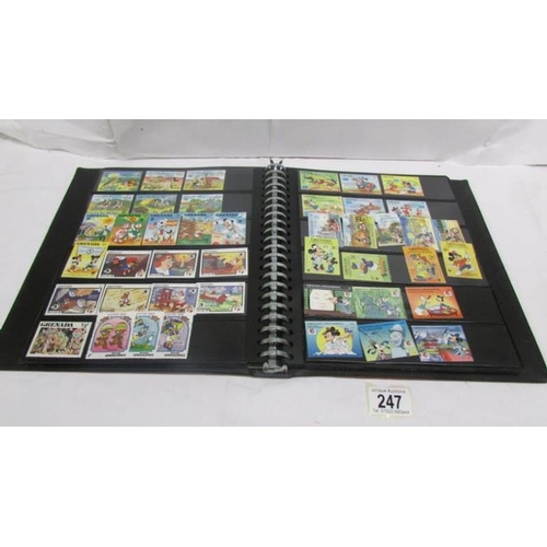 247 - An album of mainly mint Disney stamps, Angilla, Belize, Dominica, Grenada etc, mainly in sets