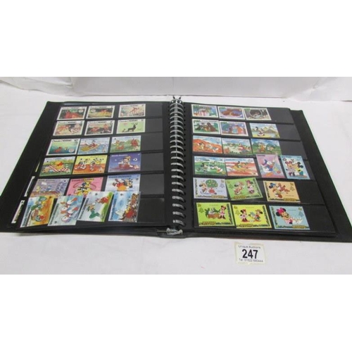 247 - An album of mainly mint Disney stamps, Angilla, Belize, Dominica, Grenada etc, mainly in sets