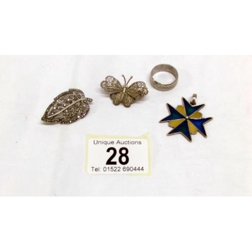 28 - A silver ring, 2 silver brooches marked 800 and an import Maltese silver cross