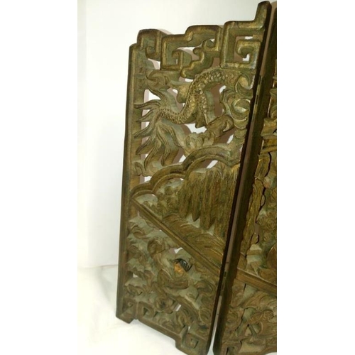 285 - An intricately carved small oriental 3 fold screen