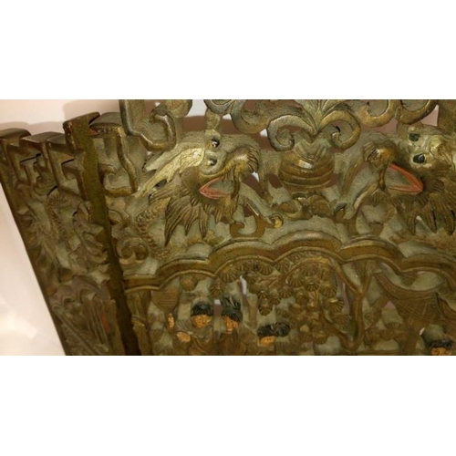 285 - An intricately carved small oriental 3 fold screen