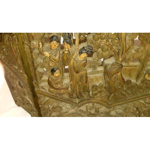 285 - An intricately carved small oriental 3 fold screen