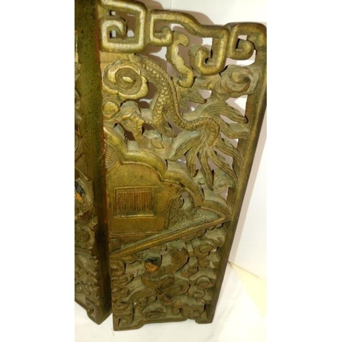 285 - An intricately carved small oriental 3 fold screen