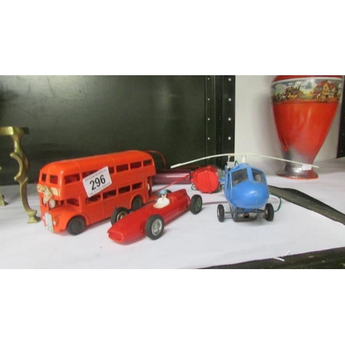 296 - A vintage plastic Lincoln toys remote bus, Marx remote helicopter etc