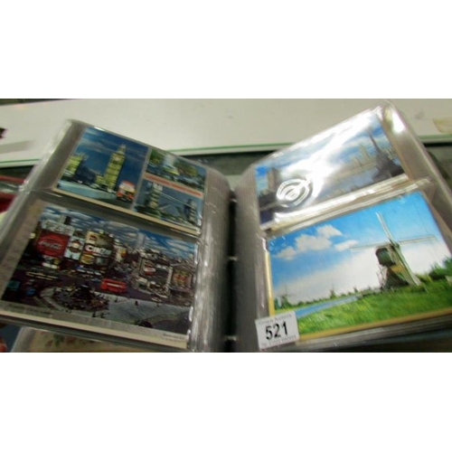 521 - 2 albums of postcards