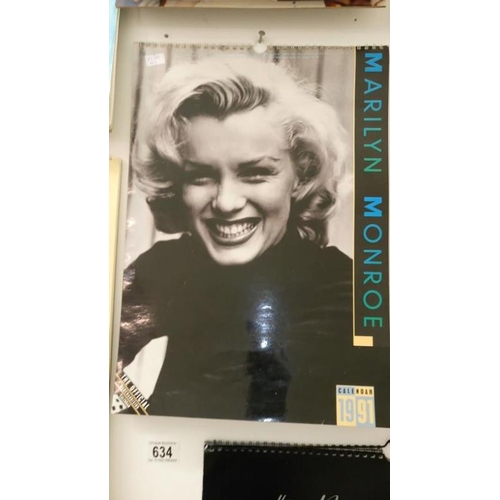 634 - A quantity of calenders including Elvis Presley, Marylin Monroe, Guiness & Pirelli etc.