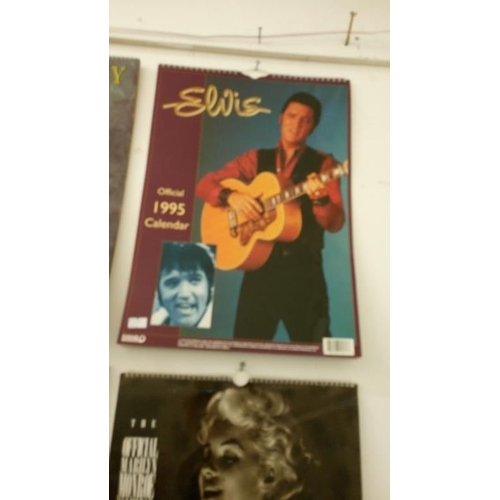 634 - A quantity of calenders including Elvis Presley, Marylin Monroe, Guiness & Pirelli etc.