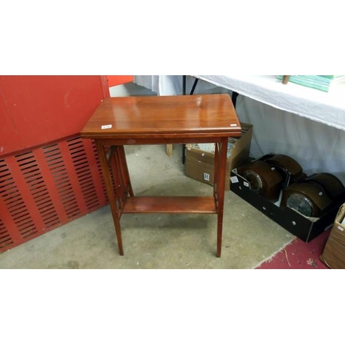 670 - A mahogany occasional table