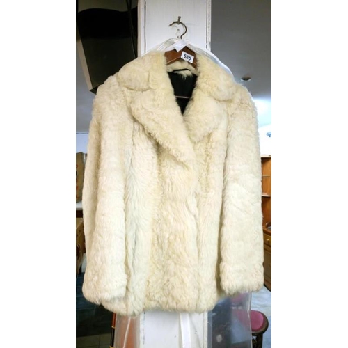 685 - A white fur fabric jacket