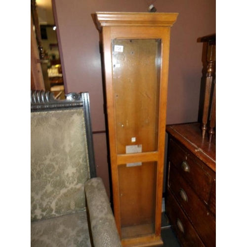 735 - A tall glazed cabinet