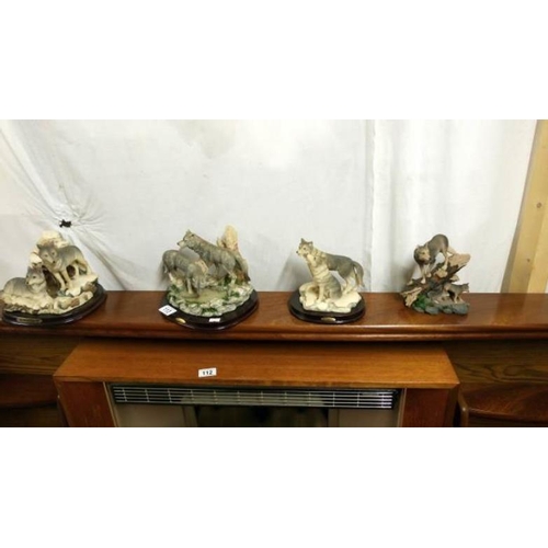 113 - 4 wolf figurines