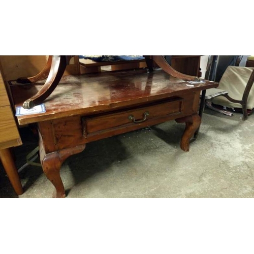 185 - A heavy mahogony coffee table with drawer