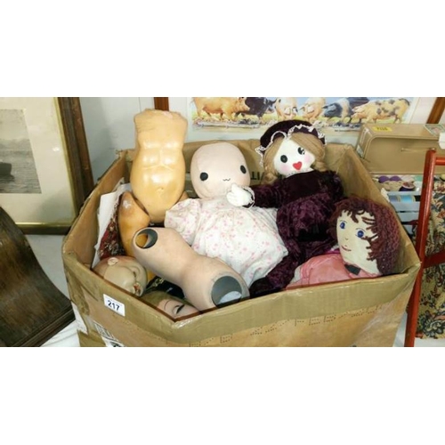 217 - A box of old dolls & part dolls