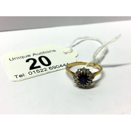 20 - A gold ring set sapphire and diamonds, marked 18ct, size P