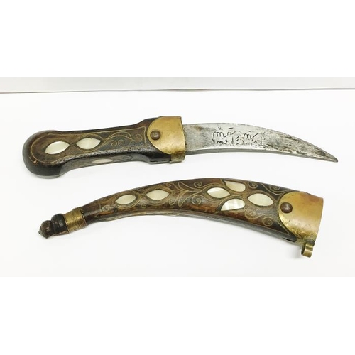 112 - An Eastern dagger inlaid with mother of pearl and brass together with a skinning knife