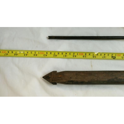 558 - A quantity of 1920's/30's ethnographic heavy palm wood tribal weapons including long bow, club spear... 