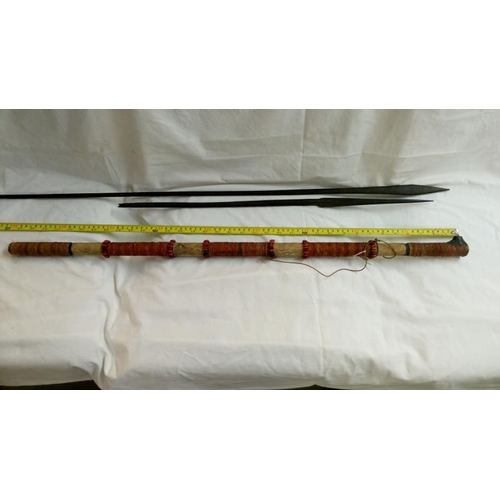 558 - A quantity of 1920's/30's ethnographic heavy palm wood tribal weapons including long bow, club spear... 