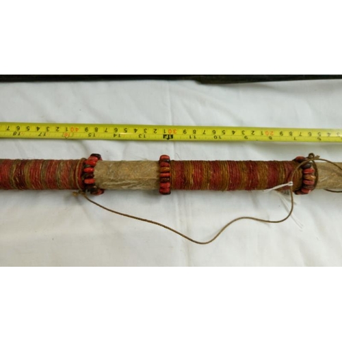 558 - A quantity of 1920's/30's ethnographic heavy palm wood tribal weapons including long bow, club spear... 