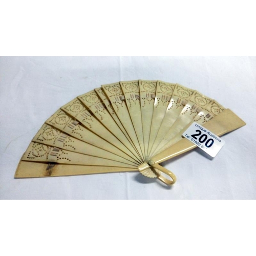 200 - A collection of mainly Chinese and hand painted fans, approximately 20