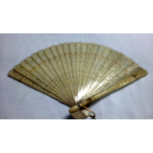 200 - A collection of mainly Chinese and hand painted fans, approximately 20