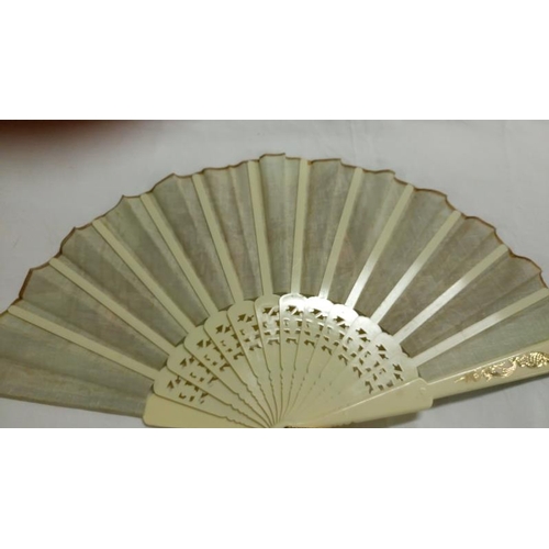 200 - A collection of mainly Chinese and hand painted fans, approximately 20