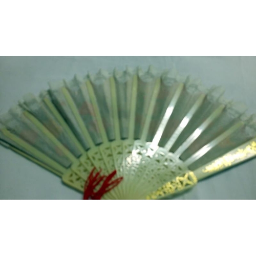 200 - A collection of mainly Chinese and hand painted fans, approximately 20