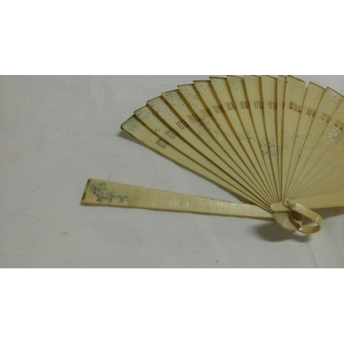 200 - A collection of mainly Chinese and hand painted fans, approximately 20